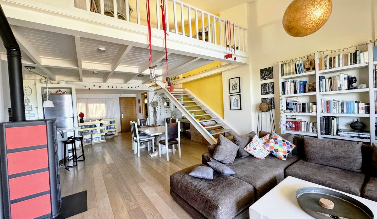 Upper ground floor - open-plan kitchen, dining, and living area