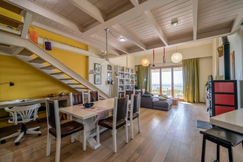 Upper ground floor - open-plan kitchen, dining, and living area